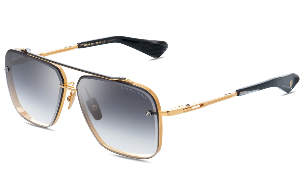A close up shot of DITA MACH-SIX DTS121-62 sunglasses in Yellow Gold - Black Rhodium (lens is Grey to Clear Gradient) DTS121-62-01-Z