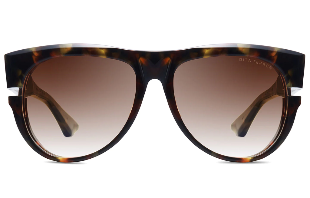 A close up shot of DITA TERRON DTS703-A sunglasses in Haute Tortoise - White Gold (lens is Brown to Clear Gradient) DTS703-A-02-Z.