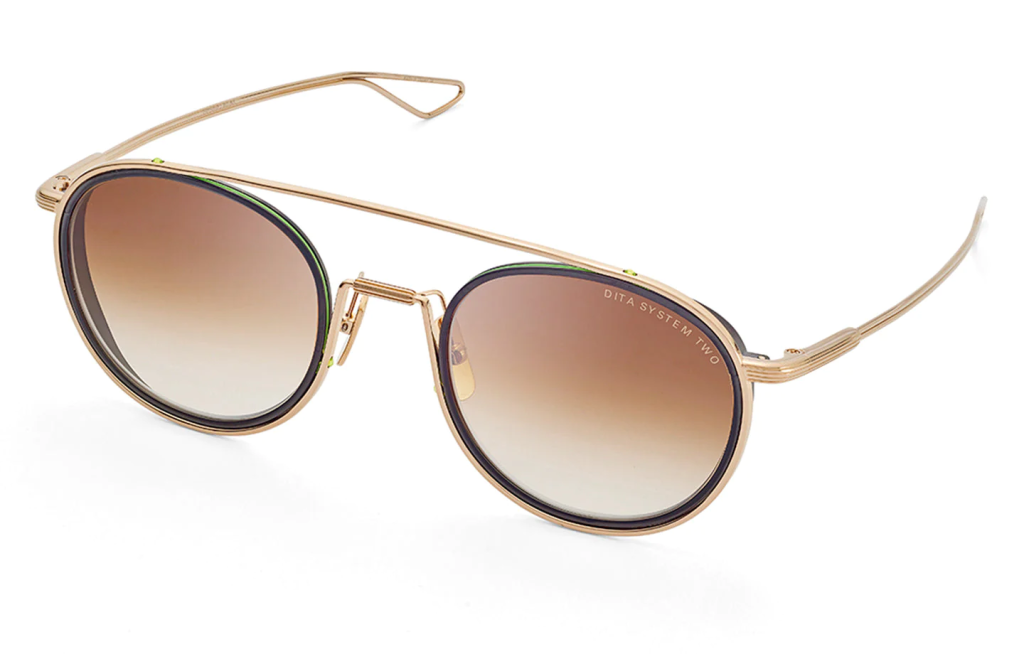 A close up shot of DITA SYSTEM-TWO DTS115-51 sunglasses in Black/Gold (lens is Brown Gradient) DTS115-51-02-Z.