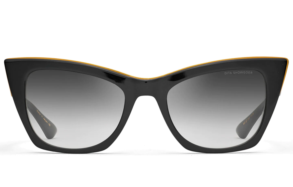 A close up shot of DITA SHOWGOER DTS513-50 sunglasses in Black - Black Swirl - Yellow Gold (lens is Grey to Clear Gradient) DTS513-50-01-Z.