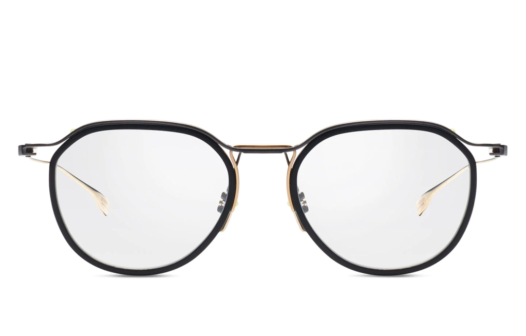 A close up shot of DITA SCHEMA-TWO DTX131-49 sunglasses in Black Iron/Gold (lens is Clear) DTX131-49-02-Z.
