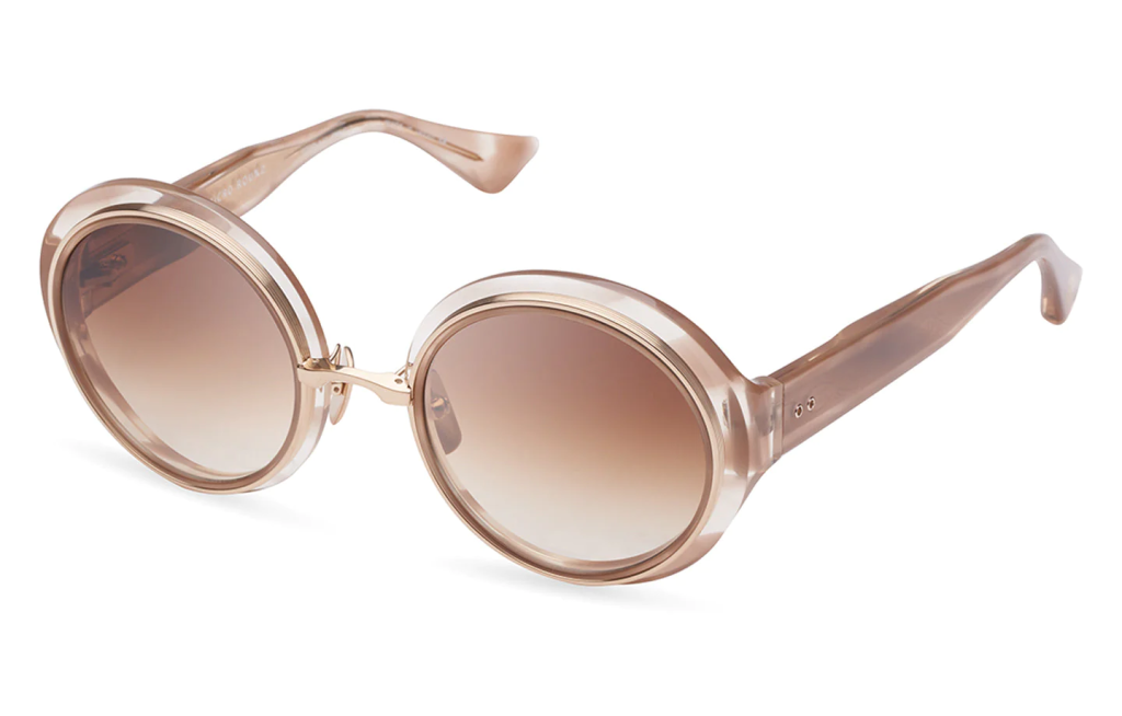 A close up shot of DITA MICRO-ROUND DTS406-A sunglasses in Dusty Pink Swirl - White Gold (lens is Dark Brown to Clear Gradient) DTS406-A-02.