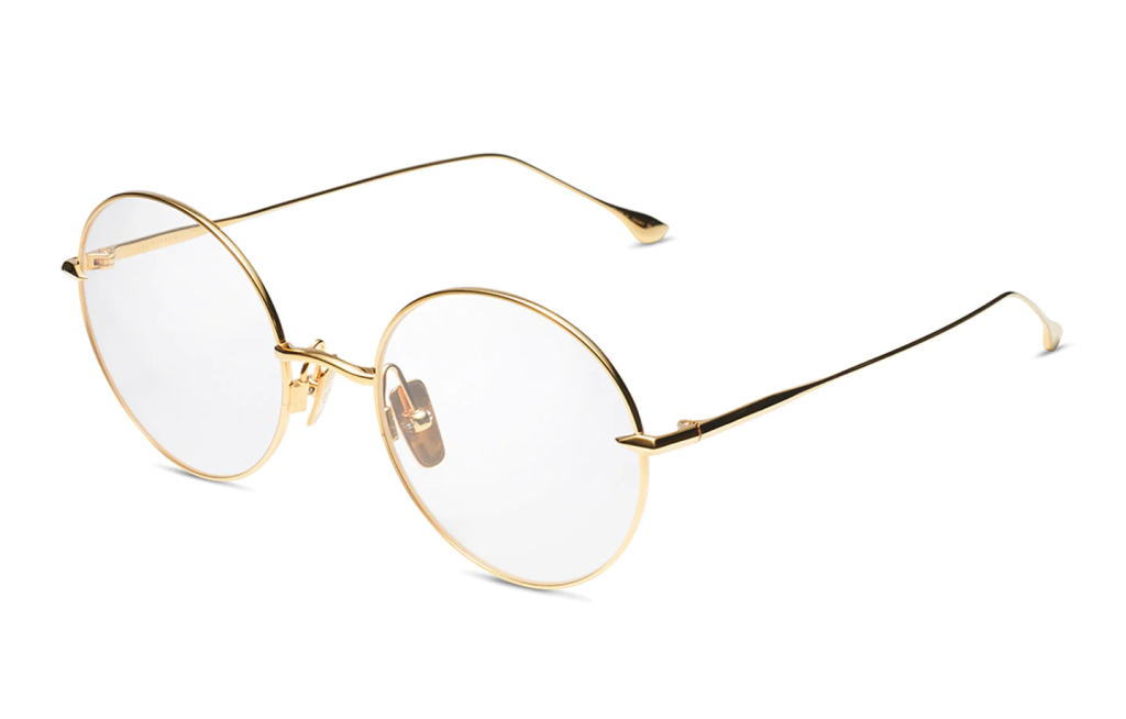 A close up shot of DITA Believer Optical DTX506-52 sunglasses in Yellow Gold (lens is Clear) DTX506-52-04-Z.
